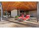 Spacious patio with lounge chairs, dining table, and a view of the surrounding greenery at 2961 Augusta Dr, Las Vegas, NV 89109