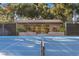A pristine full tennis court with manicured greenery at 2961 Augusta Dr, Las Vegas, NV 89109