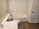 Bathroom featuring neutral walls, tub, and sink, all in a simple functional design at 2986 Juniper Hills Blvd # 202, Las Vegas, NV 89142