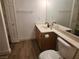 Bright bathroom featuring a modern sink, neutral walls and wood-look vinyl floors at 2986 Juniper Hills Blvd # 202, Las Vegas, NV 89142
