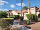 Beautiful condo building with well-maintained landscaping and a red tile roof at 2986 Juniper Hills Blvd # 202, Las Vegas, NV 89142