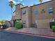 Condo building with stucco exterior, arched windows, and unit numbers clearly displayed at 2986 Juniper Hills Blvd # 202, Las Vegas, NV 89142