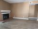 Living room with a fireplace and laminate flooring at 2986 Juniper Hills Blvd # 202, Las Vegas, NV 89142
