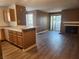 Open-concept layout with fireplace, wood-look flooring, and access to outdoor space at 2986 Juniper Hills Blvd # 202, Las Vegas, NV 89142