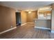 Open concept living area with laminate flooring, adjacent to the kitchen at 2986 Juniper Hills Blvd # 202, Las Vegas, NV 89142