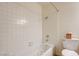 Bathroom with a tub and shower combo, toilet, and wall cabinet at 3063 Chapala Dr, Las Vegas, NV 89120