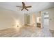 Spacious bedroom with wood floors, fan, access to ensuite bath, and closets at 3063 Chapala Dr, Las Vegas, NV 89120