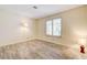 Bedroom features wood-look floors, large window with shutters, and wall lighting at 3063 Chapala Dr, Las Vegas, NV 89120