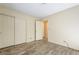 Bedroom with wood-look floors, closet, and door to the hall at 3063 Chapala Dr, Las Vegas, NV 89120