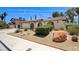 Charming home with stucco siding, desert landscaping, an attached two-car garage and tile roof at 3063 Chapala Dr, Las Vegas, NV 89120