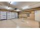 Spacious garage with ample storage and organization space, including shelving and insulation at 3063 Chapala Dr, Las Vegas, NV 89120