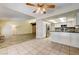 Open floor plan showcasing the kitchen with stainless steel appliances and views of the adjoining living area at 3063 Chapala Dr, Las Vegas, NV 89120