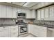 Updated kitchen featuring stainless steel appliances and granite countertops at 3063 Chapala Dr, Las Vegas, NV 89120