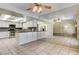 Open kitchen with white cabinets, stainless steel appliances, and granite countertops at 3063 Chapala Dr, Las Vegas, NV 89120