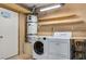 Convenient laundry area with washer, dryer, and water heater, providing practical functionality at 3063 Chapala Dr, Las Vegas, NV 89120