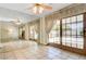 Bright living room with tile flooring, fireplace, and sliding glass doors to outdoor space at 3063 Chapala Dr, Las Vegas, NV 89120