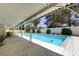 Inviting in-ground pool and covered patio area for shaded relaxation and outdoor enjoyment on sunny days at 3063 Chapala Dr, Las Vegas, NV 89120