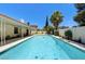 Enjoy the backyard oasis featuring a refreshing in-ground pool and covered patio for relaxation and fun at 3063 Chapala Dr, Las Vegas, NV 89120