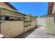 Outdoor storage area with shelving units for organizing tools and equipment, ensuring a clutter-free outdoor space at 3063 Chapala Dr, Las Vegas, NV 89120