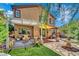 Inviting backyard with covered patio, comfortable seating, yellow awning, and a relaxing fountain at 326 Caneflower Ct, North Las Vegas, NV 89031