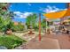 Inviting backyard with a water fountain, patio, and lush landscaping at 326 Caneflower Ct, North Las Vegas, NV 89031