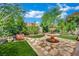 Well-manicured backyard featuring a stone water fountain centerpiece at 326 Caneflower Ct, North Las Vegas, NV 89031