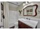 Bathroom featuring a single sink vanity with a white countertop and a shower-tub combo at 326 Caneflower Ct, North Las Vegas, NV 89031