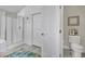 Bright bathroom featuring a glass door shower and modern fixtures at 326 Caneflower Ct, North Las Vegas, NV 89031