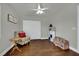 Inviting bedroom with wood floors, neutral walls, ceiling fan, and closet space at 326 Caneflower Ct, North Las Vegas, NV 89031
