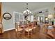 Dining room filled with natural light, highlighting the hardwood floors and plantation shutters at 326 Caneflower Ct, North Las Vegas, NV 89031