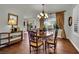 Cozy dining room with hardwood floors and view to backyard at 326 Caneflower Ct, North Las Vegas, NV 89031