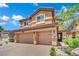 Stunning two-story home with a three-car garage and well-maintained landscaping at 326 Caneflower Ct, North Las Vegas, NV 89031