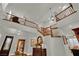 Grand foyer with a staircase, chandelier, hardwood floors, and stylish decor at 326 Caneflower Ct, North Las Vegas, NV 89031
