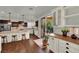 Bright, airy kitchen with stainless steel appliances, granite countertops, and sliding glass door to backyard at 326 Caneflower Ct, North Las Vegas, NV 89031