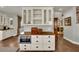 Kitchen cabinet featuring butcher block countertop, stainless steel oven, and overhead display cabinet at 326 Caneflower Ct, North Las Vegas, NV 89031