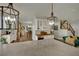 Open kitchen features granite countertops, pendant lighting and transitions to dining and living space at 326 Caneflower Ct, North Las Vegas, NV 89031