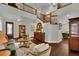Spacious living room with hardwood floors, a staircase, and elegant decor at 326 Caneflower Ct, North Las Vegas, NV 89031