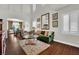 Bright living room featuring hardwood floors, stylish furniture, and an open floor plan at 326 Caneflower Ct, North Las Vegas, NV 89031