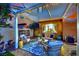 Cozy covered patio with stylish outdoor furniture and decor, perfect for entertaining and relaxing outside at 326 Caneflower Ct, North Las Vegas, NV 89031