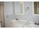 Bathroom with dual sink vanity, framed mirrors, and updated fixtures at 3260 N Heritage Way, Las Vegas, NV 89121