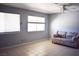 Comfortable bedroom with large windows, neutral tones, and tile flooring at 3260 N Heritage Way, Las Vegas, NV 89121