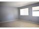 Neutral bedroom with tile floors, bright windows, and ample natural light at 3260 N Heritage Way, Las Vegas, NV 89121