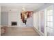 Spacious living room featuring a fireplace, large windows, and hardwood flooring at 3260 N Heritage Way, Las Vegas, NV 89121