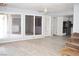 Open-concept living area with hardwood floors, ample natural light, and easy access to the kitchen at 3260 N Heritage Way, Las Vegas, NV 89121