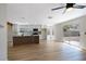 Modern kitchen with white cabinets, wood-look island, stainless steel appliances and wood-look flooring at 356 Gulfport Ct, Las Vegas, NV 89145