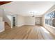 Bright and airy living room with wood floors, featuring staircase and open entrance at 356 Gulfport Ct, Las Vegas, NV 89145