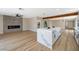 Open floorplan features modern fireplace, kitchen island, and ample natural light at 356 Gulfport Ct, Las Vegas, NV 89145