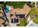 Captivating aerial shot of a home featuring solar panels, pool, patio and large backyard with mature landscaping at 3708 Lorraine Ln, Las Vegas, NV 89120