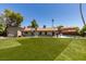 Spacious backyard featuring a well-maintained lawn, providing ample space for outdoor activities and relaxation at 3708 Lorraine Ln, Las Vegas, NV 89120