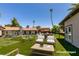 Staged backyard showcasing a lush lawn, outdoor furniture, and play equipment, ideal for Gathering activities and entertainment at 3708 Lorraine Ln, Las Vegas, NV 89120